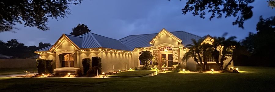 Warm white permanent lighting on Central Florida ranch home